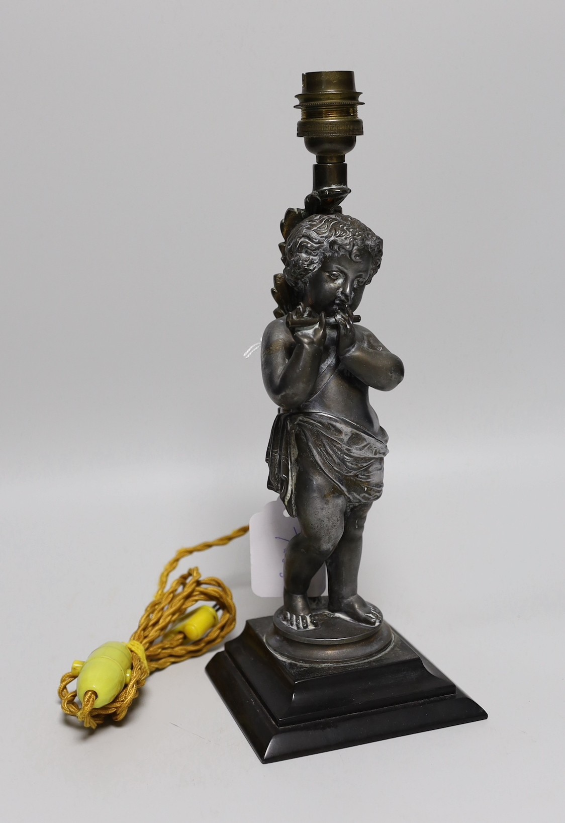 A silvered metal ‘cherub’ lamp base, 30cms high